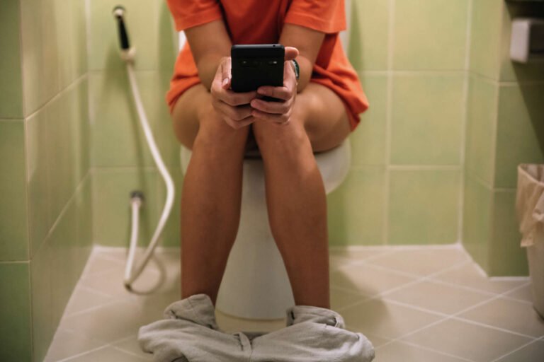 Sitting On Toilet