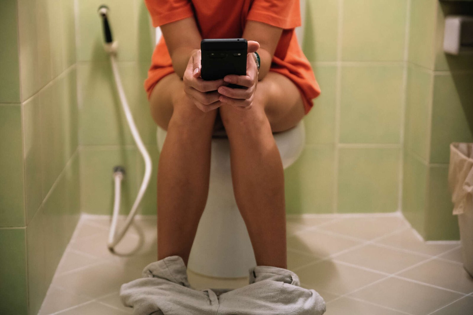 Sitting On Toilet